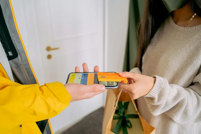 Smartphone showing a clean checkout screen with a single product and payment field