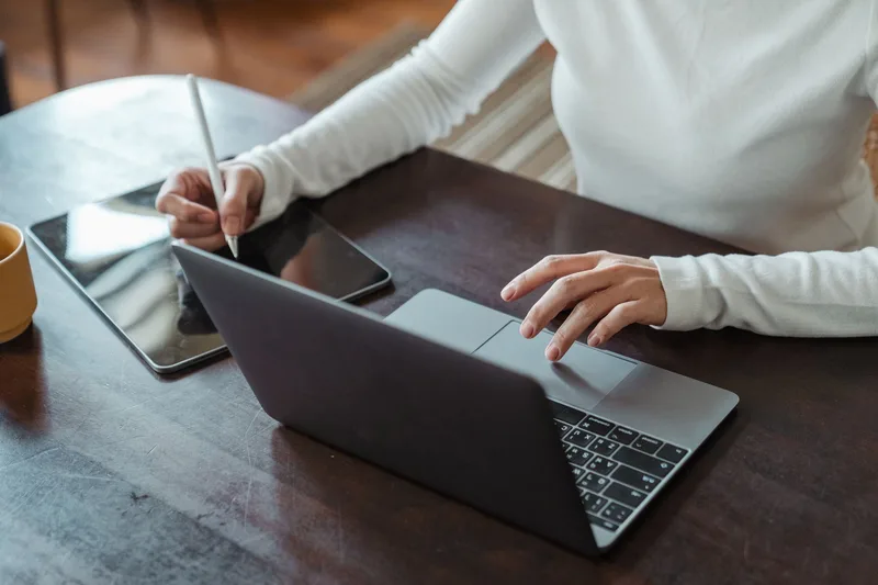 Person working at laptop analyzing business data and website performance